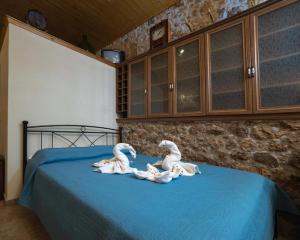 Letto o letti in una camera di Menecrates Rustic - San Matteo
