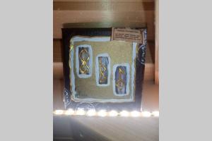 a cake in a box on a shelf at KOTA Finlandais bien être , les gîtes de l'étang in La Chapelle