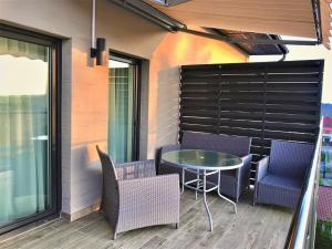 Posedenie v ubytovaní Apartament z widokiem na morze - Apartament Turkusowy