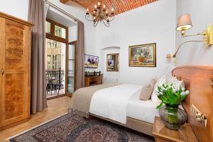 Postel nebo postele na pokoji v ubytování Ventus Rosa Boutique Aparthotel + 37 fotografií