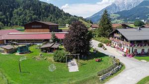 an aerial view of a small village with a playground at Ferienwohnung am Baby & Kinderbauerhof Stefflhof in Saalfelden am Steinernen Meer