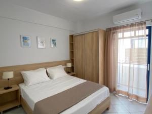 Postel nebo postele na pokoji v ubytování Elounda Canali 2 Apts
