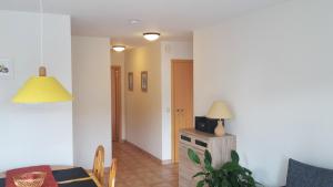 a living room with a table and a dining room at Seeholiday - Ferienwohnung Korte in Meersburg