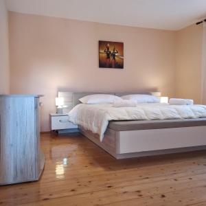 Ένα ή περισσότερα κρεβάτια σε δωμάτιο στο Apartman Poldrugovac