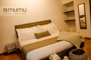 Letto o letti in una camera di Mumu by Bernalo Hotels