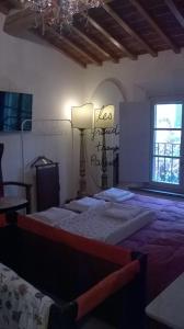 A bed or beds in a room at Casa Costanza