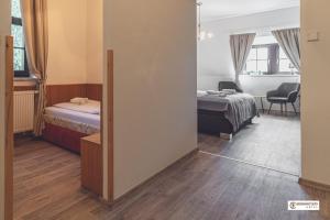 Postel nebo postele na pokoji v ubytování Hotel Nemojanský mlýn