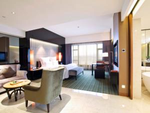Voodi või voodid majutusasutuse Pullman Dongguan Changan toas