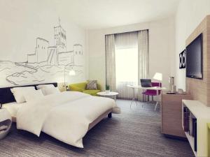 מיטה או מיטות בחדר ב-Mercure Sohar