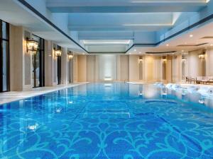 a large swimming pool in a hotel room at Sofitel Shanghai Hongqiao in Shanghai
