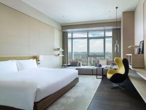 Voodi või voodid majutusasutuse Sofitel Foshan Shunde toas