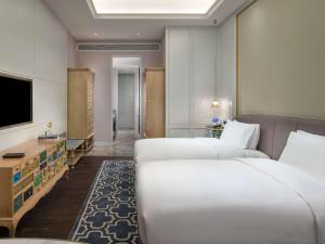 Televiisor ja/või meelelahutuskeskus majutusasutuses Sofitel Foshan Shunde