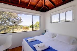 Cama ou camas em um quarto em Loft na Lagoa da Conceição