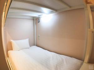 Postel nebo postele na pokoji v ubytování Place‧X Hotel