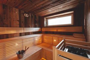 a sauna with a window and a bench in it at Freinerhof & Wellness in Neuberg an der Mürz