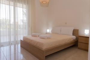 Un ou plusieurs lits dans un hébergement de l'établissement Luxury apartment in Heraklion
