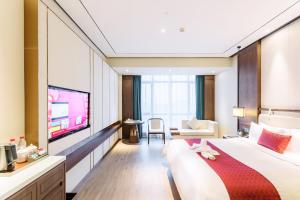 Televisyen dan/atau pusat hiburan di Days Hotel by Wyndham Binjiang Changsha
