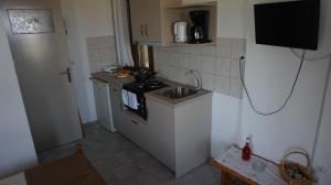 Kuchyň nebo kuchyňský kout v ubytování Stella Rooms