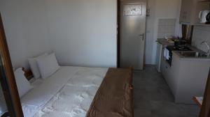 Kuchyň nebo kuchyňský kout v ubytování Stella Rooms