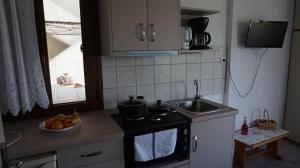 Kuchyň nebo kuchyňský kout v ubytování Stella Rooms