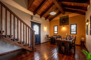 a living room with a staircase and a table at Suzanna in Odem in Odem