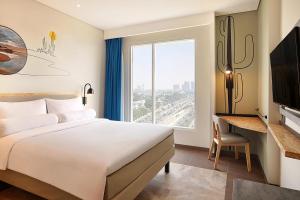 เตียงในห้องที่ ibis Styles Jakarta Simatupang