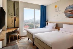 เตียงในห้องที่ ibis Styles Jakarta Simatupang