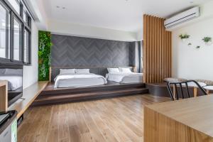 A bed or beds in a room at Meets Anping