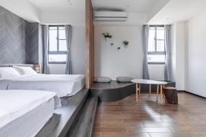 A bed or beds in a room at Meets Anping