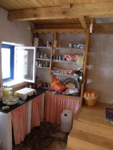 a kitchen with a counter and a window at Lošinj house robinson Vinodarska, Island Lošinj in Nerezine