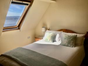 Katil atau katil-katil dalam bilik di White Cottage B&B