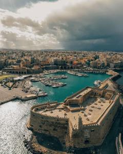 an aerial view of a harbor with boats in the water at Theros by Agora Luxury Apartments in the heart of Heraklion in Heraklio Town