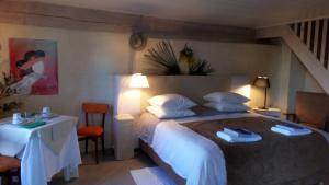 Кровать или кровати в номере Clos du Gaja près de Jazz in Marciac