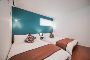 Postel nebo postele na pokoji v ubytování Villa COLORS〜Ocean〜