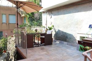 an outdoor patio with a table and an umbrella at Ca Du Rocco - CITRA 011019-LT-0343 in Monterosso al Mare