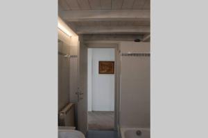 a bathroom with a sink and a shower and a door at Ca Du Rocco - CITRA 011019-LT-0343 in Monterosso al Mare +20 photos