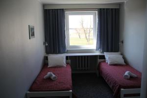 Postel nebo postele na pokoji v ubytování Staadioni Hotel