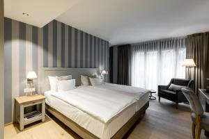 Hotel Ascovilla Charming Hideway tesisinde bir odada yatak veya yataklar