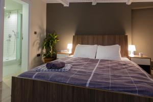 
Кровать или кровати в номере Moda Drei
