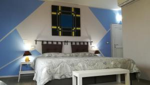 Postel nebo postele na pokoji v ubytování Sotto l'Ulivo