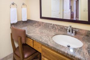 a bathroom with two sinks and a mirror at Villas de Santa Fe in Santa Fe