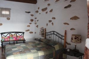 Posteľ alebo postele v izbe v ubytovaní Casa Abuelo Rafael