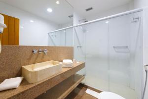 a bathroom with a sink and a shower at B&B Hotels Rio Copacabana Forte in Rio de Janeiro