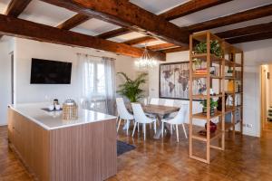 a kitchen and dining room with a table and chairs at Le Radici in Isola del Piano