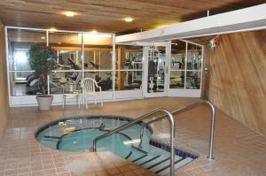 a hot tub in the middle of a building at Ramada by Wyndham Abbotsford in Abbotsford