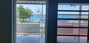 a view of the ocean from a window at Aguada of the Seas in Aguada
