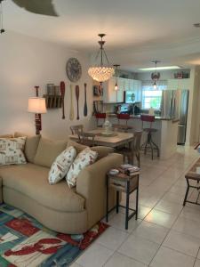 a living room with a couch and a kitchen at Bahama Breeze #4 Sea Dancer Condos in South Padre Island