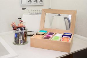 a wooden box sitting on top of a counter at COZY&QUIET apartment with A/C in city centre in Prague +13 photos