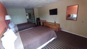 Ένα ή περισσότερα κρεβάτια σε δωμάτιο στο Mission Inn