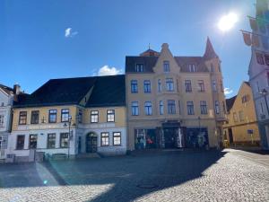 a group of buildings on a city street at UsedomTor 1720 FeWo I in Wolgast